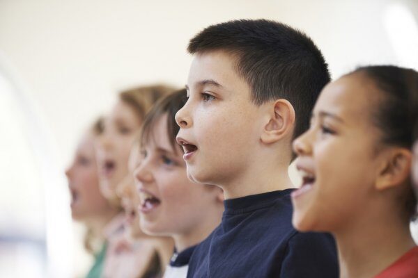 depositphotos_70421845-stock-photo-group-of-school-children-singing.jpg